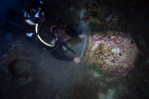 An archaeologist measure the mouth of a pithos by V Mentogianis