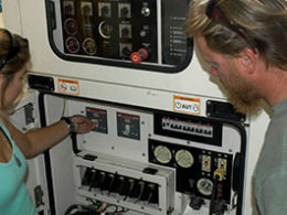 photo of inside of vessel Hercules showing crew maintaining controls